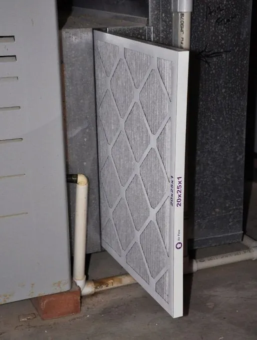 new furnace filter being installed