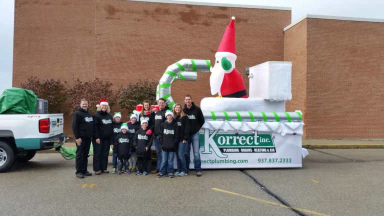 team next to an inflatable santa