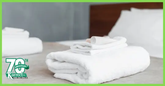 Folded towels on a bed