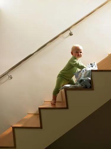 Baby climbing up the steps