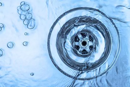 Water flowing down a drain