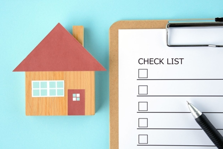 graphic of a home with a checklist next to it