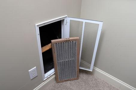 dirty air filter next to HVAC return vent