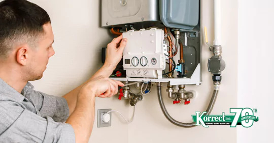 man working on boiler