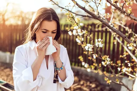 Woman sneezing