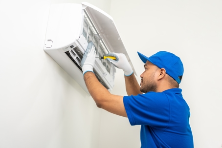 Man repairing an AC