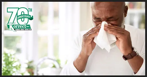 Man blowing his nose.